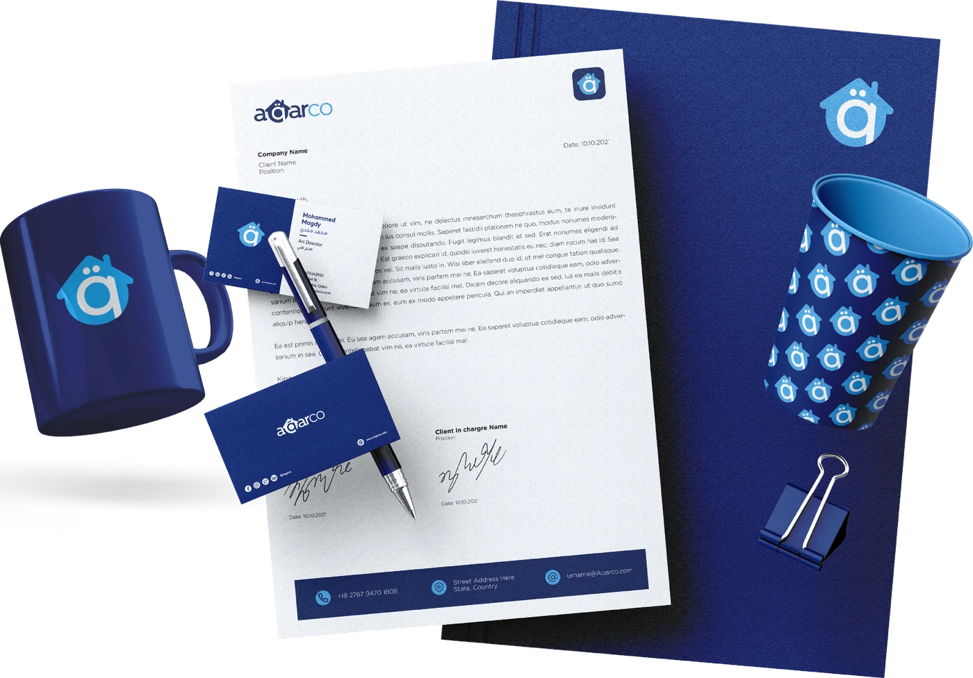 The stationery set: folder, letterhead, business cards, cup, pen and mug in navy and soft blue.