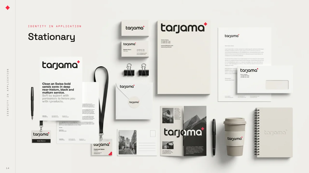 Two deck pages of the Tarjama stationery laid out flat: business cards, letterhead, envelopes, compliment slips, a lanyard, notebooks, a folded brochure, stickers and a coffee cup, in cream, black and red.