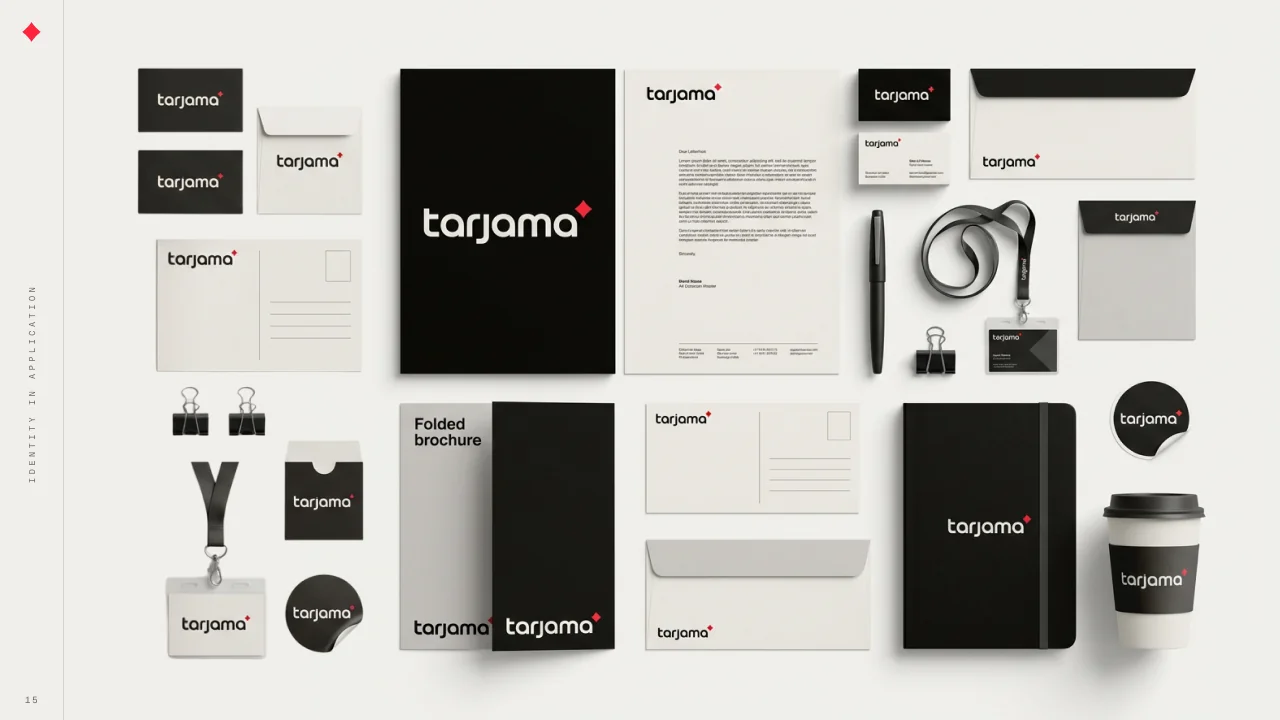 Two deck pages of the Tarjama stationery laid out flat: business cards, letterhead, envelopes, compliment slips, a lanyard, notebooks, a folded brochure, stickers and a coffee cup, in cream, black and red.